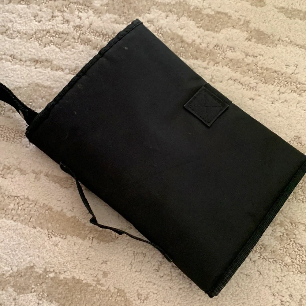 Black travel diaper changer - netting pockets, carry handle